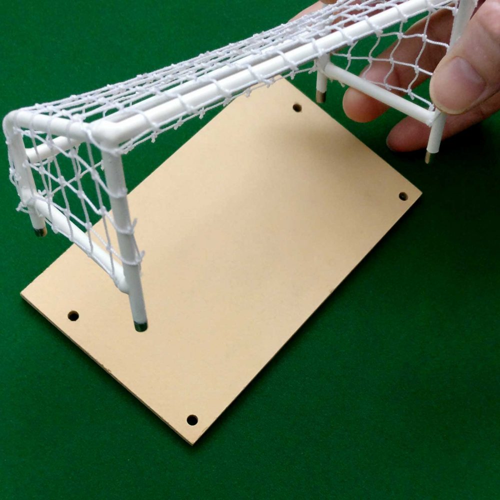 FlickForKicks handmade metal indoor 5-a-side goal shown with hole drilling template